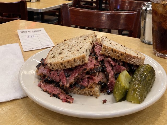 A pastrami on rye with pickles at Katz's Delicatessen